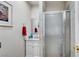 Modern bathroom features a glass shower, vanity with a marble countertop, and chrome fixtures at 8365 Haven St, Las Vegas, NV 89123
