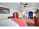Comfortable bedroom showcasing a decorative carpet, a ceiling fan, and plenty of natural light at 8365 Haven St, Las Vegas, NV 89123