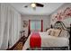 Comfortable bedroom with ceiling fan, window, art, curtains, and stylish furnishings at 8365 Haven St, Las Vegas, NV 89123