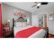 Bedroom with ceiling fan, window, art, curtains, and stylish furnishings at 8365 Haven St, Las Vegas, NV 89123