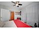 Bedroom with ceiling fan, window, art, curtains, stylish furnishings, and ensuite bathroom at 8365 Haven St, Las Vegas, NV 89123