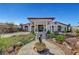 Elegant home featuring a grand entrance, manicured landscaping, and a welcoming walkway at 8365 Haven St, Las Vegas, NV 89123