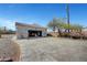 Detached two-car garage and spacious backyard with a custom concrete pad, mature trees, and plenty of room at 8365 Haven St, Las Vegas, NV 89123