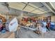 Detached two-car garage interior featuring ample storage space, work benches, and overhead lighting at 8365 Haven St, Las Vegas, NV 89123