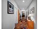 Hallway with neutral walls, unique patterned floors and decorative artwork at 8365 Haven St, Las Vegas, NV 89123
