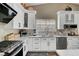 Well-lit kitchen with stainless steel appliances, modern countertops, and custom cabinetry at 8365 Haven St, Las Vegas, NV 89123