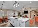 Open kitchen with a spacious island, modern appliances, and a connected dining area at 8365 Haven St, Las Vegas, NV 89123