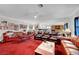 Expansive living room featuring multiple seating areas, and bright lighting at 8365 Haven St, Las Vegas, NV 89123