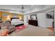 Spacious main bedroom with a king-size bed, dresser, and sitting area, creating a relaxing retreat at 8365 Haven St, Las Vegas, NV 89123