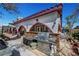 Backyard with stone outdoor kitchen, covered lounge, barbecue station, hardscape, and patio space for outdoor entertaining at 8365 Haven St, Las Vegas, NV 89123