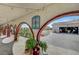 Outdoor area showcasing an arched walkway, paved patio, landscaping, and garage, blending style and functionality at 8365 Haven St, Las Vegas, NV 89123