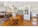 Cozy bar area with a classic fireplace, hardwood floors, and a built-in bar at 879 Judi Pl, Boulder City, NV 89005