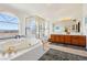 Bright bathroom with a soaking tub, a separate shower, and double vanities at 879 Judi Pl, Boulder City, NV 89005