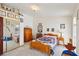 Cozy bedroom with carpet, natural light, closet with mirror, decorated with baseball trophies, and framed pictures at 879 Judi Pl, Boulder City, NV 89005
