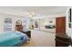 This comfortable bedroom features wall to wall carpeting, light walls and mirrored closet doors at 879 Judi Pl, Boulder City, NV 89005
