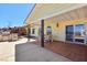 Relax on the covered patio with a built-in grill and dining space with mountain and lake views at 879 Judi Pl, Boulder City, NV 89005