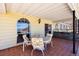 Enjoy this covered patio with tile flooring, mountain views, and space for outdoor dining and relaxing at 879 Judi Pl, Boulder City, NV 89005