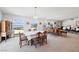 Open-concept dining area with panoramic views and classic furnishings at 879 Judi Pl, Boulder City, NV 89005