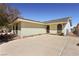 Charming single-story home with a spacious driveway and well-maintained landscaping at 879 Judi Pl, Boulder City, NV 89005