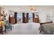 This spacious main bedroom features carpeting, large windows, ceiling fan and an ensuite bathroom at 879 Judi Pl, Boulder City, NV 89005