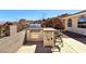 This backyard kitchen features built-in grill, tiled countertop, bar seating, and prep area at 879 Judi Pl, Boulder City, NV 89005
