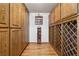 Walk-in pantry featuring extensive custom wood cabinetry and shelving for storage at 879 Judi Pl, Boulder City, NV 89005