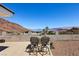 Grill and dine outdoors with views in this outdoor space that features an outdoor kitchen and seating at 879 Judi Pl, Boulder City, NV 89005