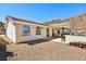 This beautiful single-story home boasts a patio area for entertaining guests and enjoying mountain views at 879 Judi Pl, Boulder City, NV 89005