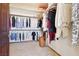 This walk in closet is well organized and features shelves and hanging rods at 879 Judi Pl, Boulder City, NV 89005