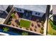 Aerial view of beautifully landscaped backyard with seating, lawn and desert landscape at 8944 Skye Canyon Ranch St, Las Vegas, NV 89166