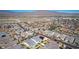 Aerial view of a residential area with houses with mountain views in the distance at 8944 Skye Canyon Ranch St, Las Vegas, NV 89166