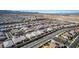 Expansive aerial shot of a neighborhood, showcasing modern homes and community layout at 8944 Skye Canyon Ranch St, Las Vegas, NV 89166