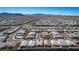 Sweeping aerial view of a Primary-planned community, set against a stunning mountain backdrop at 8944 Skye Canyon Ranch St, Las Vegas, NV 89166