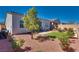 Landscaped backyard with patio space, perfect for entertaining at 8944 Skye Canyon Ranch St, Las Vegas, NV 89166