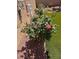 Rose bushes in rock garden featuring decorative art and artificial turf at 8944 Skye Canyon Ranch St, Las Vegas, NV 89166
