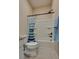 Bathroom with shower and bathtub, light tile and modern fixtures at 8944 Skye Canyon Ranch St, Las Vegas, NV 89166