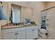 Bright bathroom with granite countertops and a large mirror over the sink at 8944 Skye Canyon Ranch St, Las Vegas, NV 89166