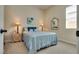 Cozy bedroom featuring large window, carpet, and simple decor at 8944 Skye Canyon Ranch St, Las Vegas, NV 89166