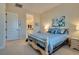 Inviting bedroom features neutral colors, an ensuite bathroom, and lots of natural light at 8944 Skye Canyon Ranch St, Las Vegas, NV 89166