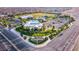 Community aerial view showing Skye Canyon Park sign, pool and recreation area, and community at 8944 Skye Canyon Ranch St, Las Vegas, NV 89166
