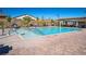 Community pool area with clean, inviting water and lounge chairs for residents at 8944 Skye Canyon Ranch St, Las Vegas, NV 89166