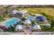 Community aerial view featuring a pool, splash pad, playground, and open green space at 8944 Skye Canyon Ranch St, Las Vegas, NV 89166