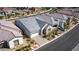 Aerial view of a cozy single-story home with stone accents, manicured landscaping, and a two-car garage at 8944 Skye Canyon Ranch St, Las Vegas, NV 89166