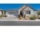 Attractive single-story home featuring a brick driveway and well-maintained front yard landscaping at 8944 Skye Canyon Ranch St, Las Vegas, NV 89166