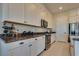 Modern kitchen with white cabinets, stainless steel appliances, and stylish countertops at 8944 Skye Canyon Ranch St, Las Vegas, NV 89166
