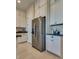 Kitchen area showcasing stainless steel refrigerator and ample cabinet space at 8944 Skye Canyon Ranch St, Las Vegas, NV 89166