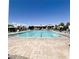 Large community pool with lounge chairs and umbrellas offers a relaxing recreational space at 8944 Skye Canyon Ranch St, Las Vegas, NV 89166