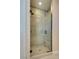 Modern bathroom featuring a glass enclosed shower with tile surround and brushed black fixtures at 8944 Skye Canyon Ranch St, Las Vegas, NV 89166