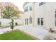 A backyard with patio, artificial grass, rocks, and landscaping offers an inviting outdoor living space at 9004 Crystal Glass Dr, Las Vegas, NV 89117