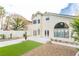 Spacious backyard with artificial grass, gravel, and a concrete patio, perfect for outdoor entertaining at 9004 Crystal Glass Dr, Las Vegas, NV 89117